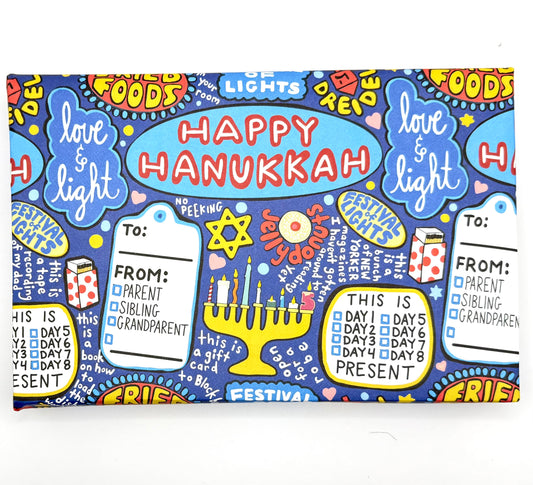 Wrapping paper with repeating “Happy Hanukkah” text and holiday icons