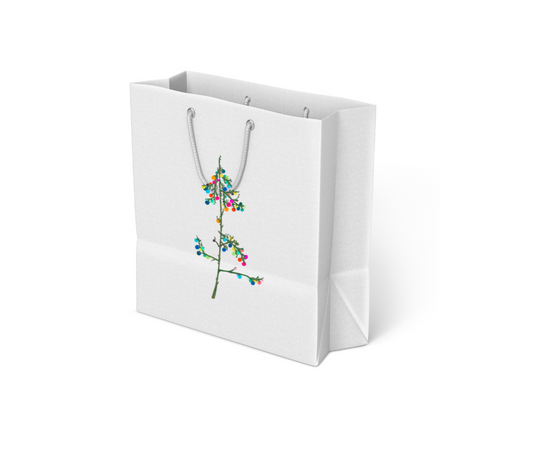 White gift bag with gray rope handles featuring an illustration of a tree branch decorated with colorful round ornaments