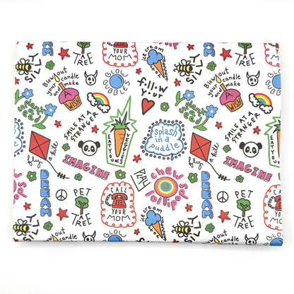 A sheet of wrapping paper with a colorful and playful design featuring text, stars, hearts, and other playful graphics.