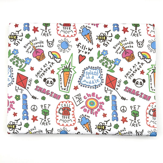 A sheet of wrapping paper with a colorful and playful design featuring text, stars, hearts, and other playful graphics.