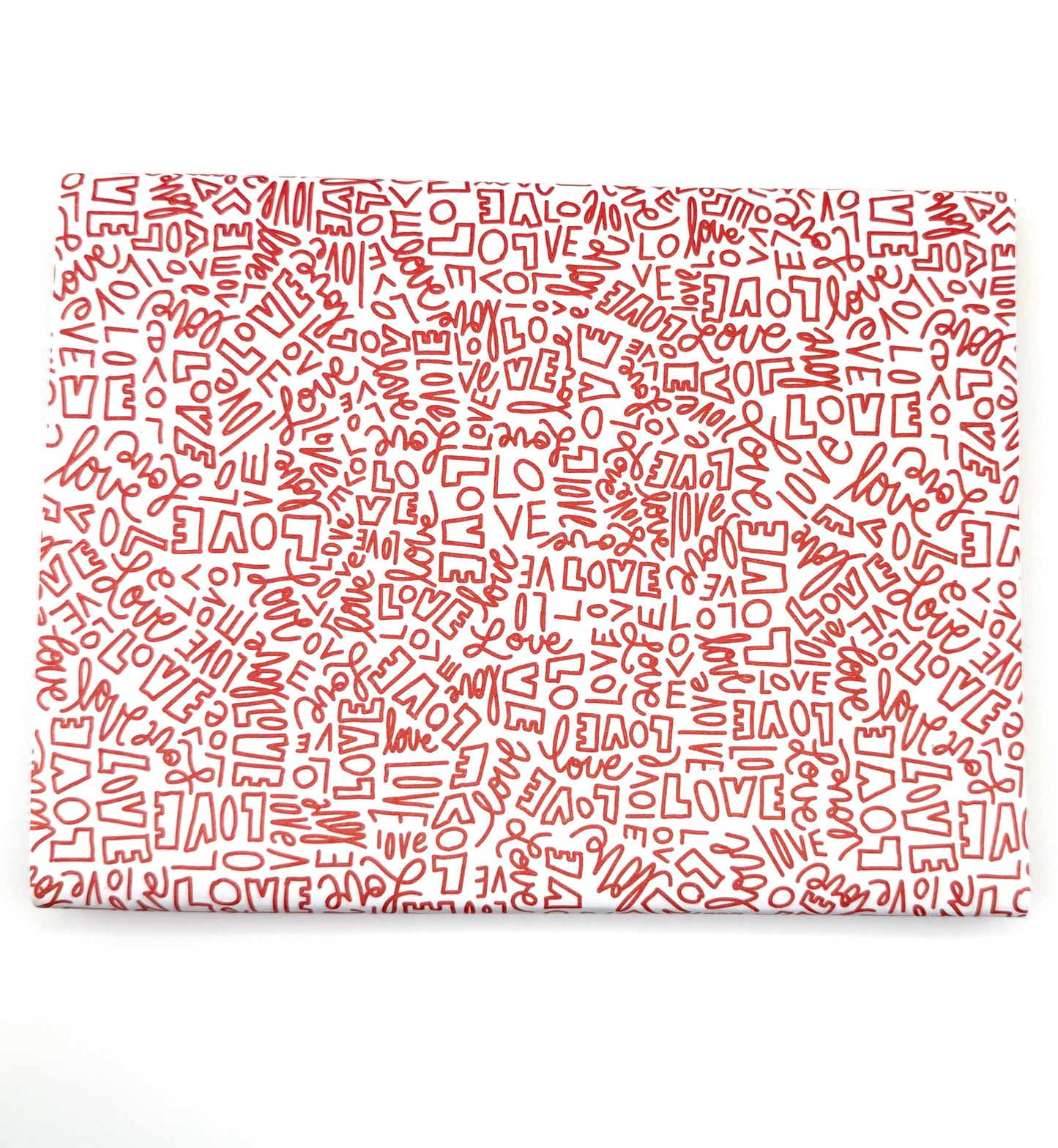 Wrapping paper with a repeating red pattern of the word "LOVE" in various fonts and sizes.