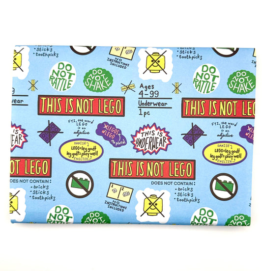 Wrapping paper with repeating “No Lego Here” text pattern